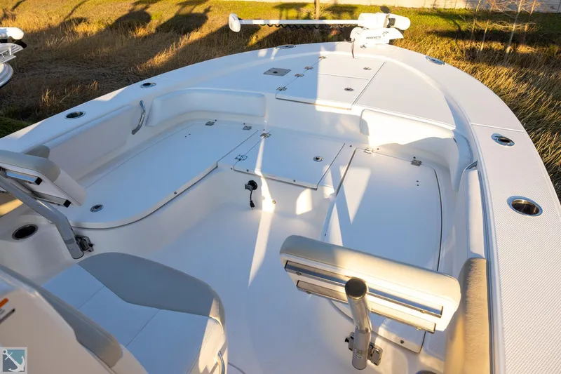 Slide: The Image of 2016 Robalo 246 Cayman boat interior with seating and storage compartments. - 13