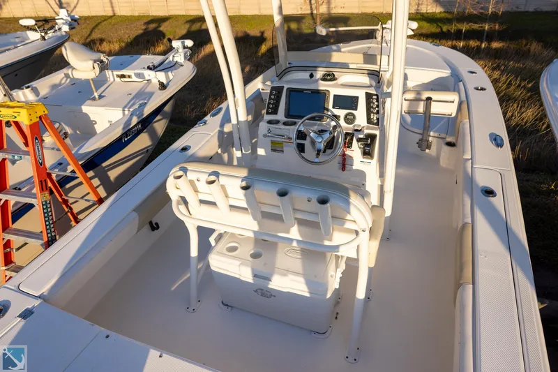 Slide: The Image of 2016 Robalo 246 Cayman boat interior with helm and seating area. - 4