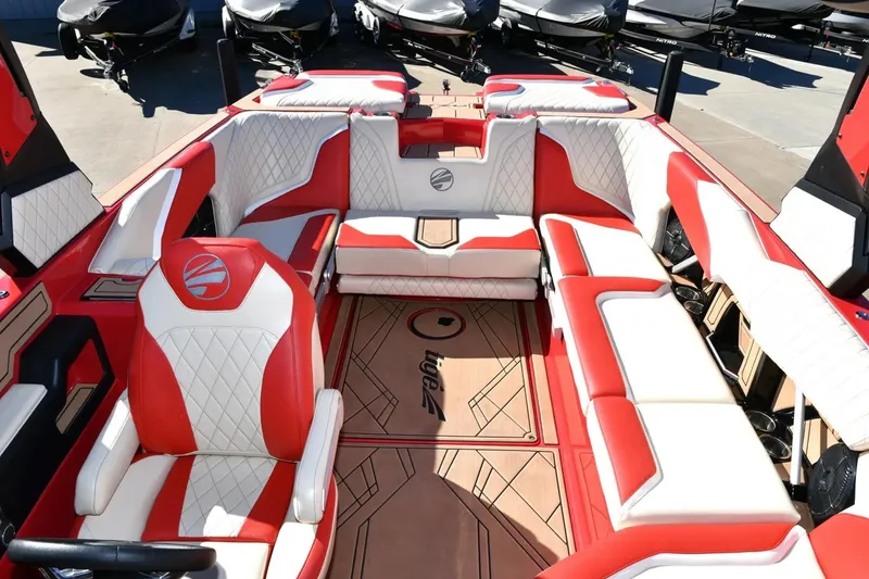Slide: The Image of 2022 Tigé 24RZX boat interior with red and white seating, showcasing luxury design. - 3