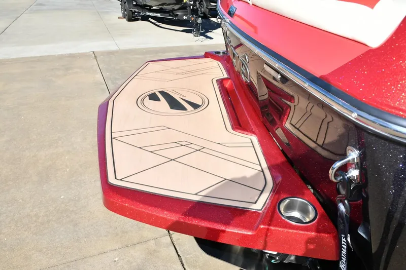 Slide: The Image of 2022 Tigé 24RZX boat with custom swim platform and sleek red finish. - 4
