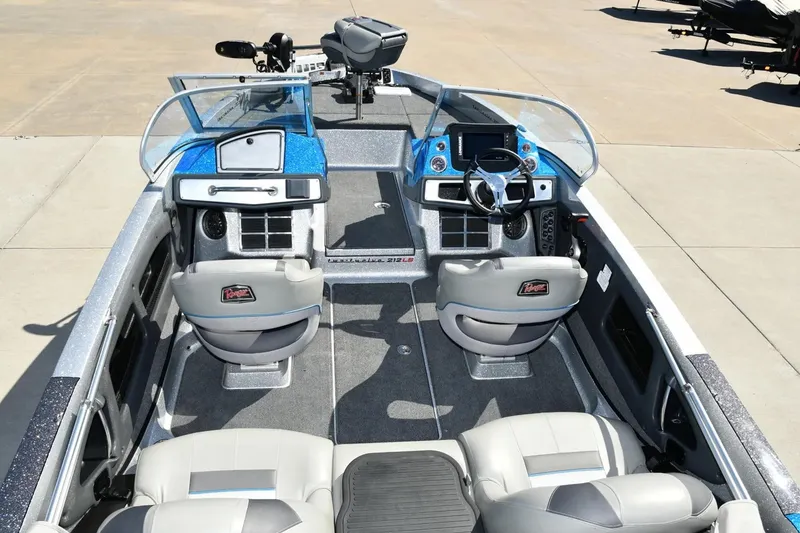Slide: The Image of 2024 Ranger 212LS Reata boat interior with dual consoles and modern seating. - 2