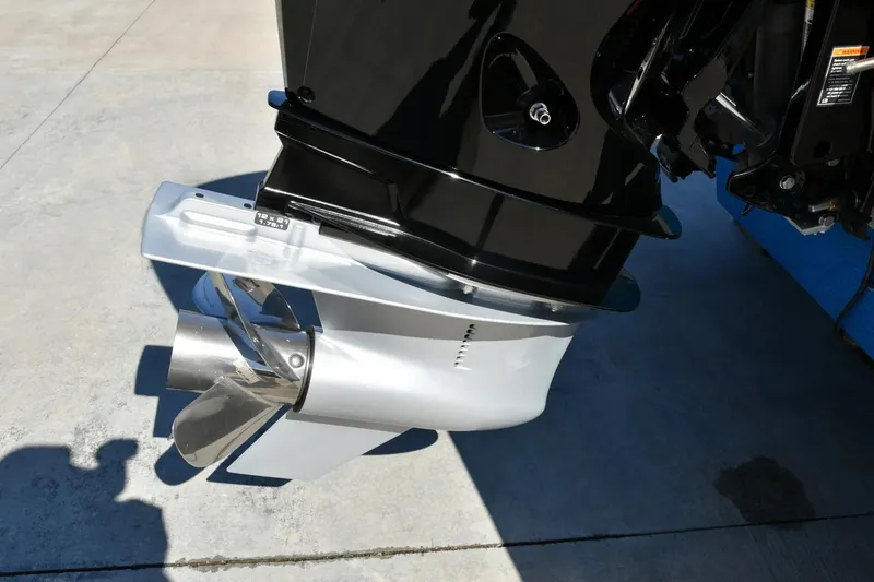 Slide: The Image of 2024 Ranger 212LS Reata boat motor and propeller on concrete surface. - 5