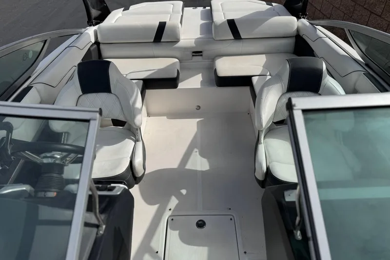 Slide: The Image of 2018 Regal 2100 Bowrider interior with white seating and modern design. - 17