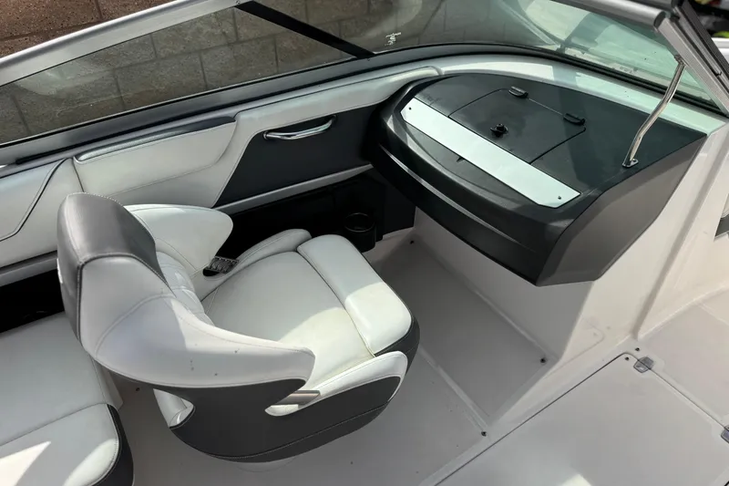 Slide: The Image of 2018 Regal 2100 Bowrider interior with sleek seating and modern dashboard design. - 22