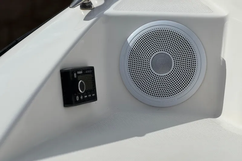 Slide: The Image of Speaker and control panel on 2018 Regal 2100 Bowrider boat interior. - 8