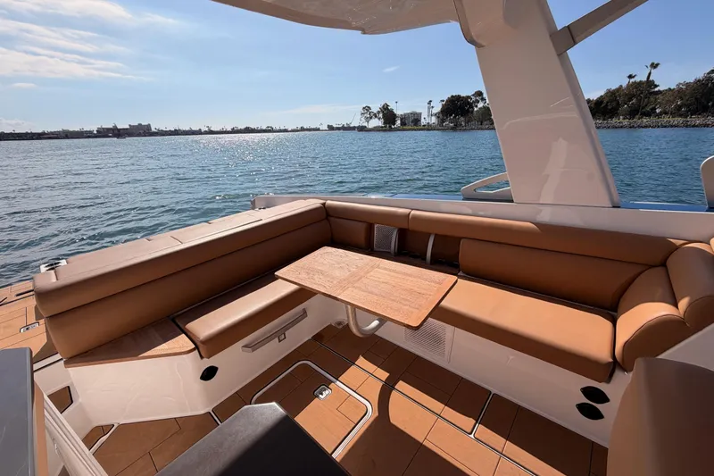 Slide: The Image of Luxurious seating area on 2022 Aviara AV32 I/O boat with scenic water view. - 14