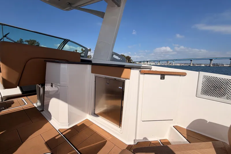 Slide: The Image of 2022 Aviara AV32 I/O boat interior with sleek design and ocean view. - 19
