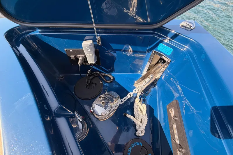 Slide: The Image of Anchor compartment of 2022 Aviara AV32 I/O boat with chain and rope. - 25