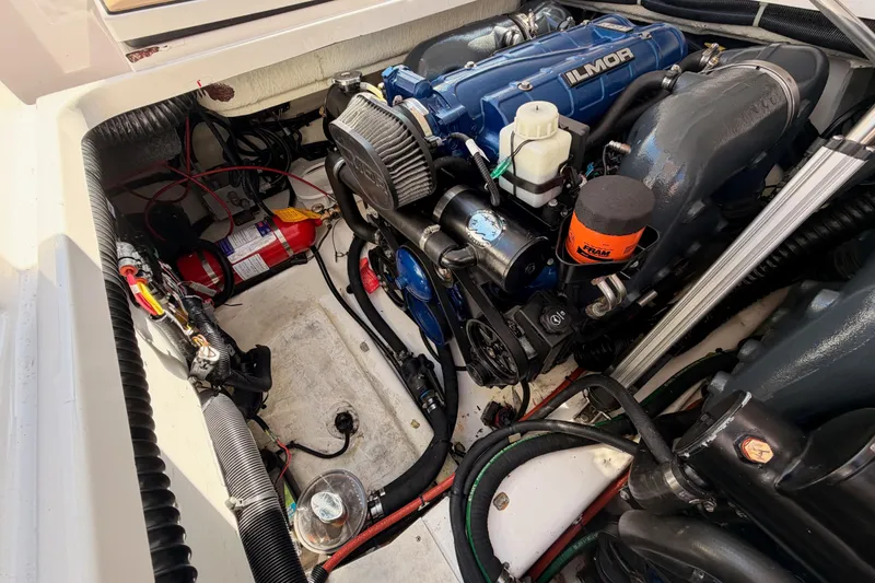 Slide: The Image of Engine compartment of 2022 Aviara AV32 I/O boat with Ilmor engine and fire extinguisher. - 47