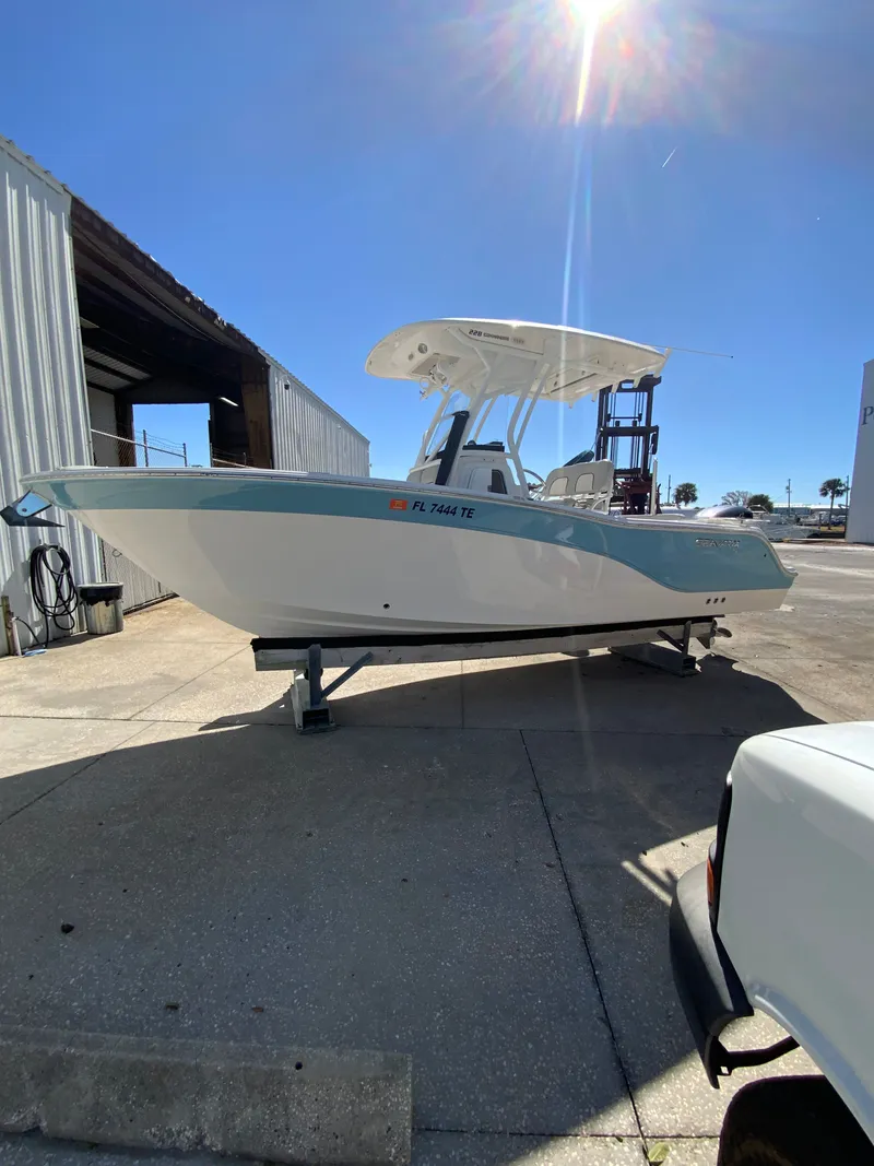 Slide: The Image of 2022 Sea Fox 228 Commander boat on a trailer outdoors. - 15