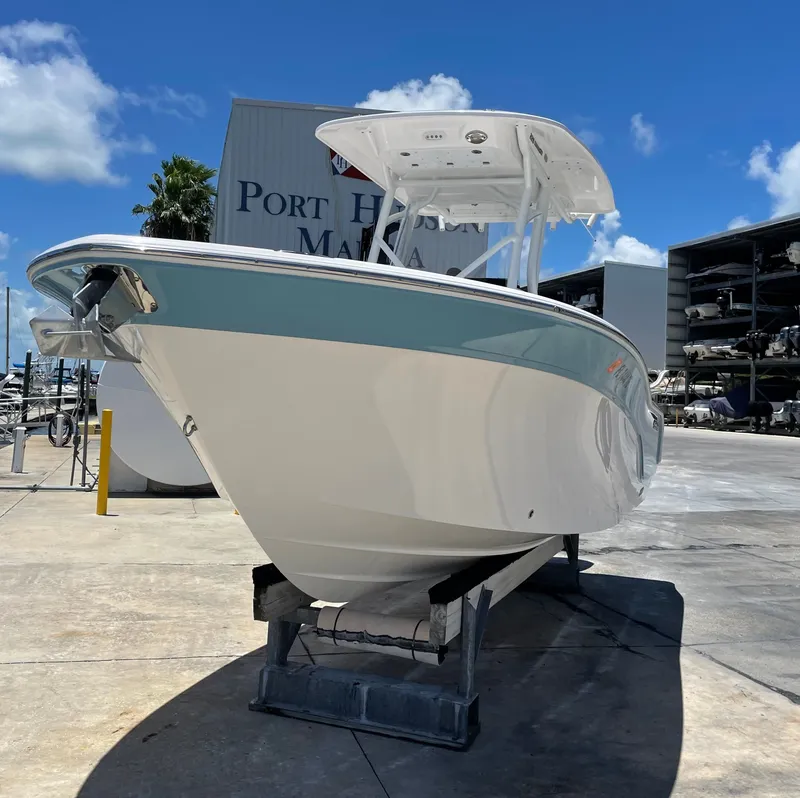 Slide: The Image of 2022 Sea Fox 228 Commander boat at marina, blue sky. - 7