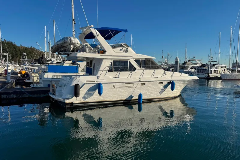 Slide: The Image of Californian 39 yacht from 2001 docked in a marina under clear blue skies. - 1