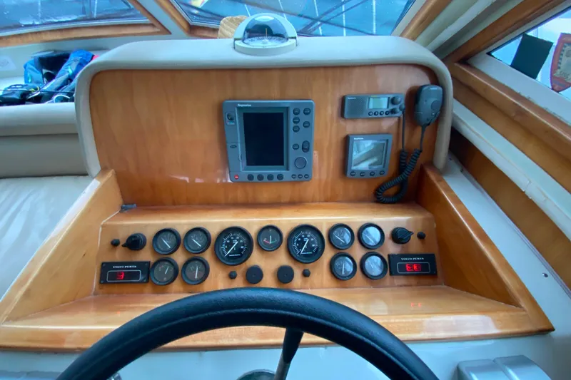 Slide: The Image of Helm of 2001 Californian 39 boat with navigation instruments and controls. - 11