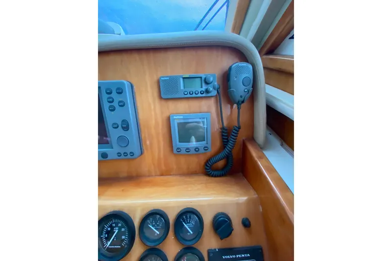 Slide: The Image of Control panel of a 2001 Californian 39 boat with navigation instruments and radio. - 14