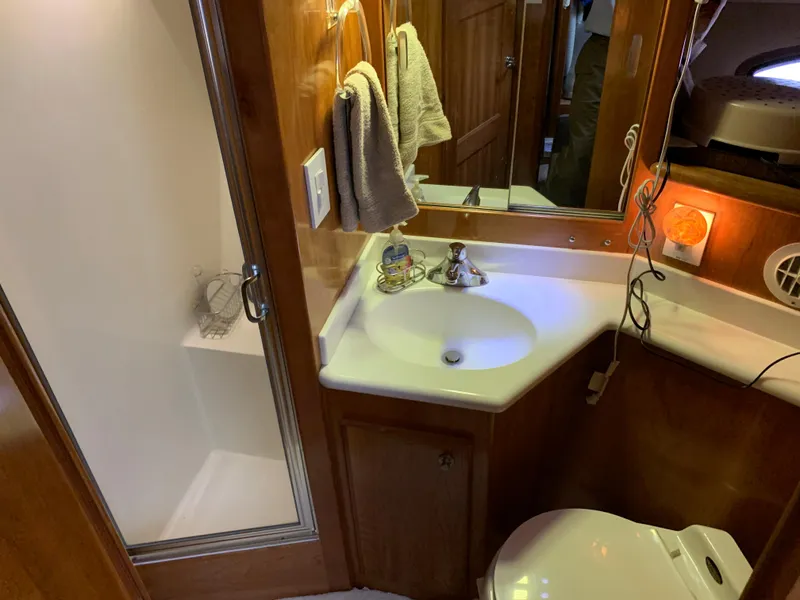 Slide: The Image of Bathroom in a 2001 Californian 39 boat, featuring shower and sink. - 19