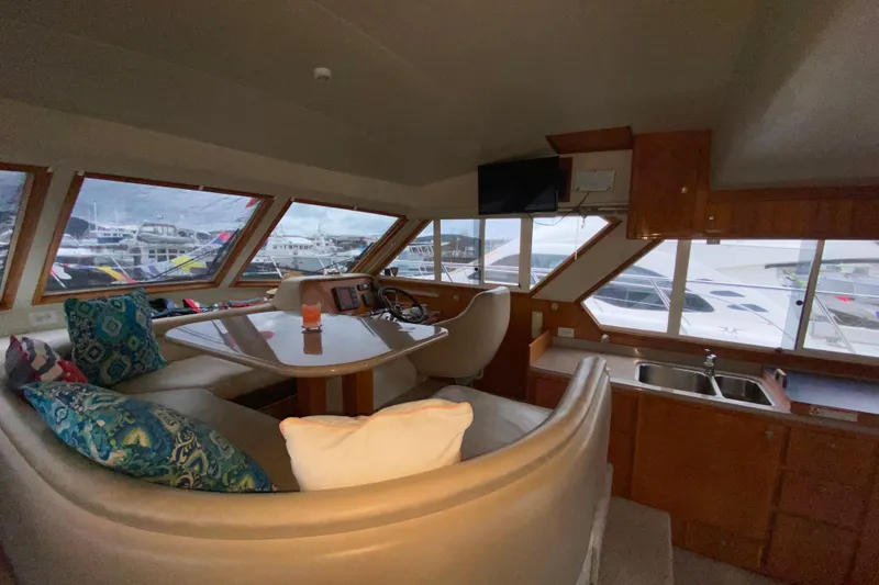 Slide: The Image of Interior of 2001 Californian 39 yacht with seating, helm, and kitchenette. - 20