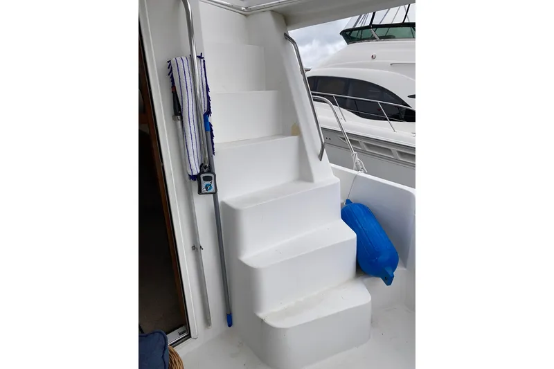 Slide: The Image of Staircase on 2001 Californian 39 yacht with blue fender and cleaning tools. - 28