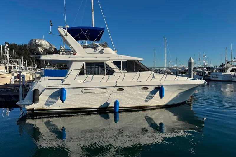 Slide: The Image of Californian 39 yacht, 2001 model, docked in a marina under clear blue skies. - 3