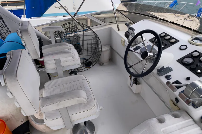 Slide: The Image of Cockpit of a 2001 Californian 39 boat with steering wheel and control panel. - 31