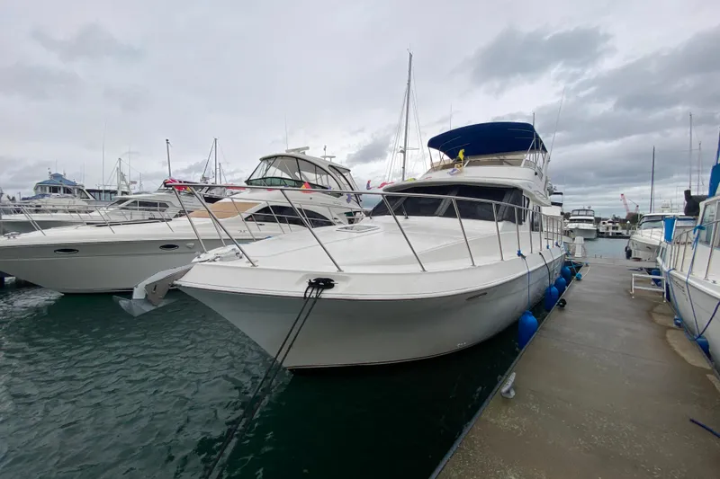 Slide: The Image of 2001 Californian 39 yacht docked at marina on a cloudy day. - 37