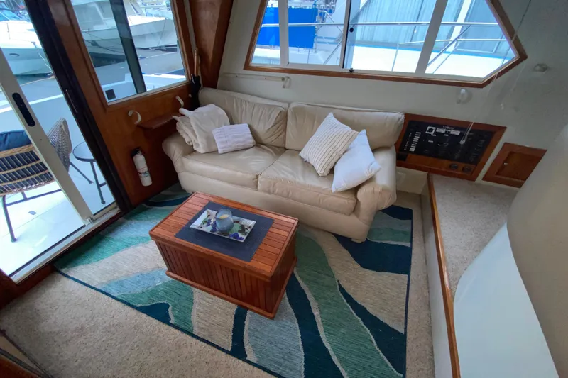 Slide: The Image of Cozy interior of 2001 Californian 39 yacht with sofa and nautical decor. - 4