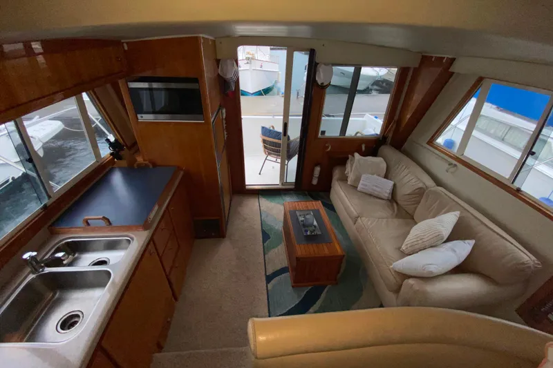 Slide: The Image of Interior of a 2001 Californian 39 yacht with cozy seating and kitchenette. - 6