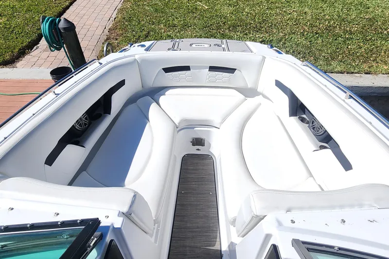 Slide: The Image of 2023 Four Winns HD8 OB boat interior with white seating and modern design. - 10
