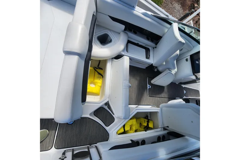 Slide: The Image of 2023 Four Winns HD8 OB boat interior with seating and storage compartments. - 28