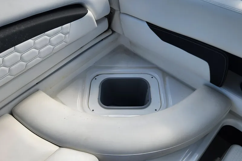 Slide: The Image of 2023 Four Winns HD8 OB boat interior seating with storage compartment. - 32