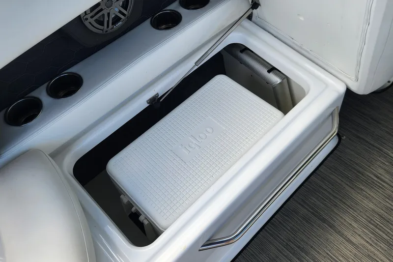 Slide: The Image of 2023 Four Winns HD8 OB boat storage with Igloo cooler and cup holders. - 33
