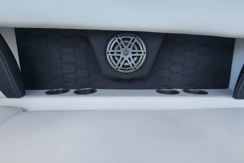 Slide: The Image of 2023 Four Winns HD8 OB boat interior with speaker and cup holders. - 46