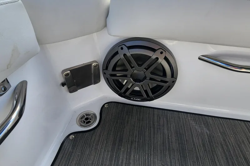 Slide: The Image of 2023 Four Winns HD8 OB boat interior with JL Audio speaker and stainless steel accents. - 48