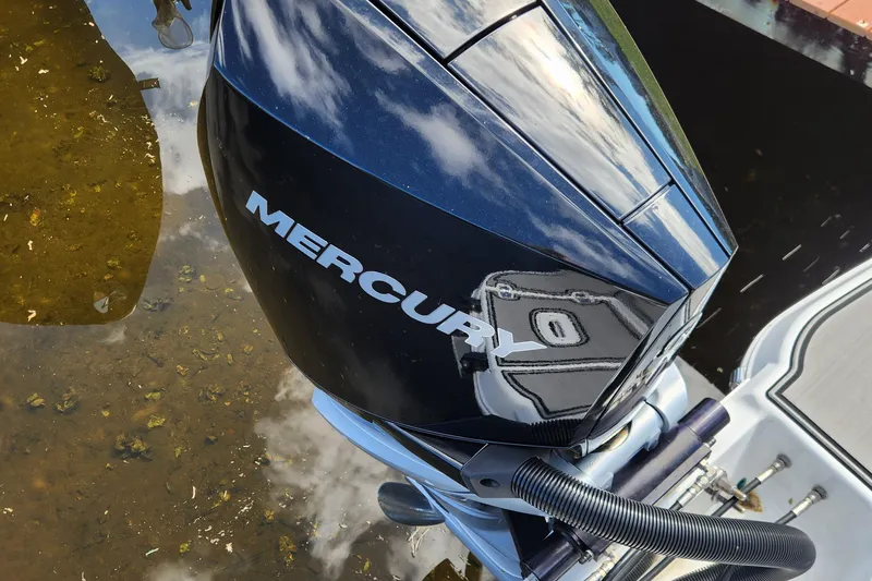 Slide: The Image of 2023 Four Winns HD8 OB with Mercury outboard motor in shallow water. - 53