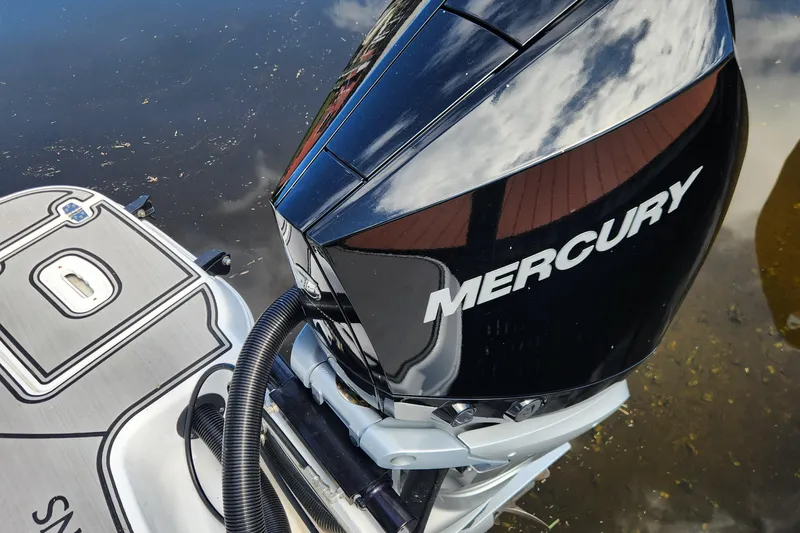 Slide: The Image of 2023 Four Winns HD8 OB with Mercury outboard engine on water. - 54