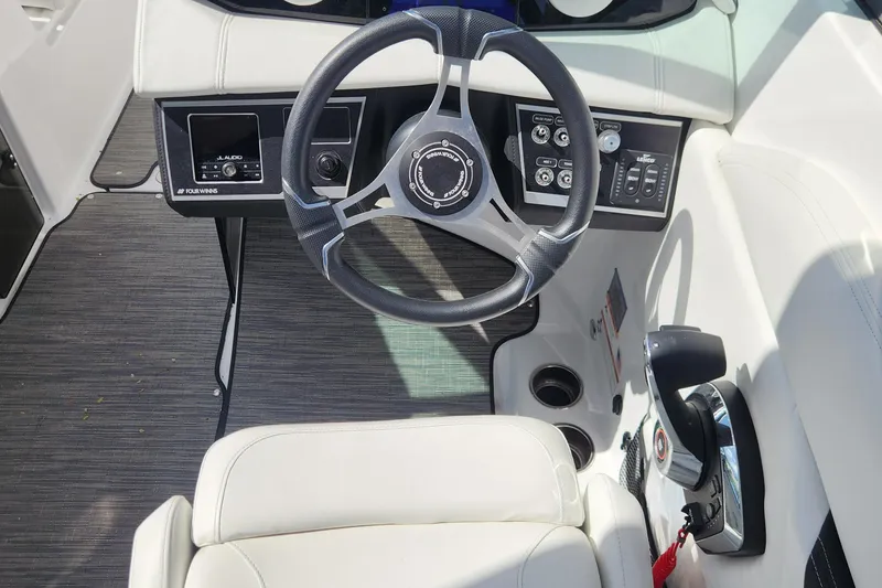 Slide: The Image of 2023 Four Winns HD8 OB boat cockpit with steering wheel and control panel. - 63