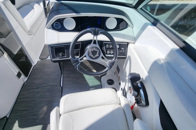 Slide: The Image of 2023 Four Winns HD8 OB boat interior with steering wheel and control panel. - 66