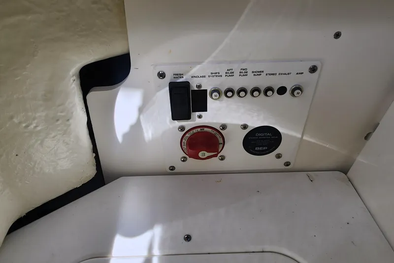 Slide: The Image of Control panel of 2023 Four Winns HD8 OB boat, featuring switches and digital display. - 70