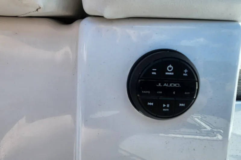 Slide: The Image of JL Audio control panel on 2023 Four Winns HD8 OB boat dashboard. - 74