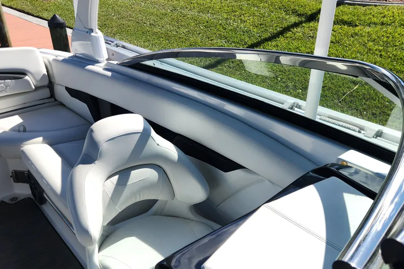 Slide: The Image of 2023 Four Winns HD8 OB boat interior with sleek white seating and modern design. - 8