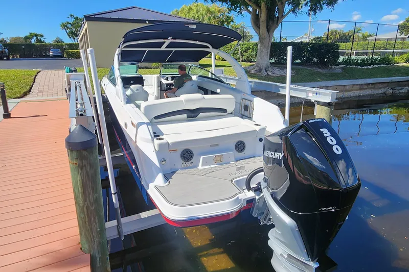Slide: The Image of 2023 Four Winns HD8 OB boat docked with Mercury 300 outboard engine. - 80