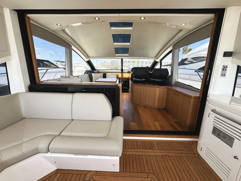 Slide: The Image of Luxurious interior of 2019 Sunseeker Predator 57 yacht with modern seating and wood accents. - 11