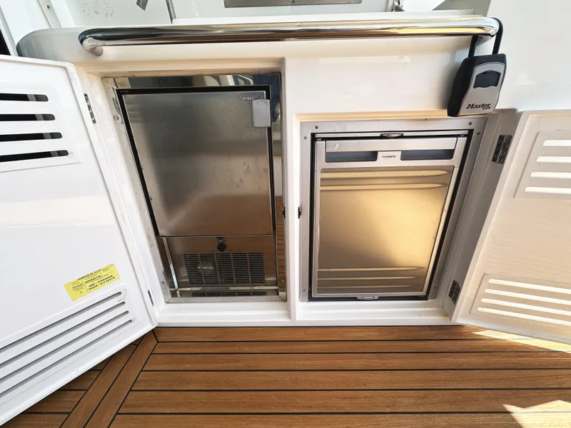 Slide: The Image of Sunseeker Predator 57 yacht galley with stainless steel appliances, 2019 model. - 15