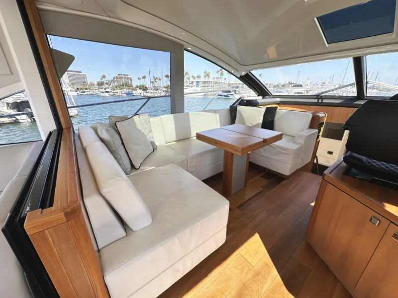 Slide: The Image of Luxurious interior of 2019 Sunseeker Predator 57 yacht with elegant seating and wooden accents. - 19