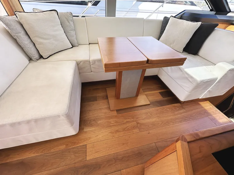 Slide: The Image of Luxurious interior of 2019 Sunseeker Predator 57 yacht with elegant seating and wooden flooring. - 23