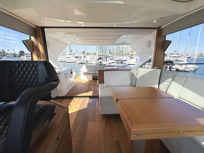 Slide: The Image of Luxurious interior of 2019 Sunseeker Predator 57 yacht with elegant seating and wooden accents. - 25