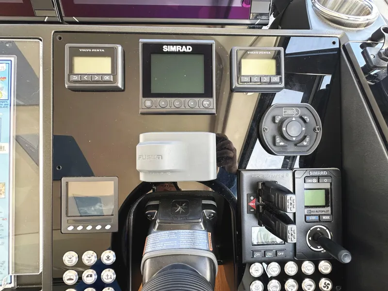 Slide: The Image of Control panel of a 2019 Sunseeker Predator 57 yacht with navigation and system displays. - 29