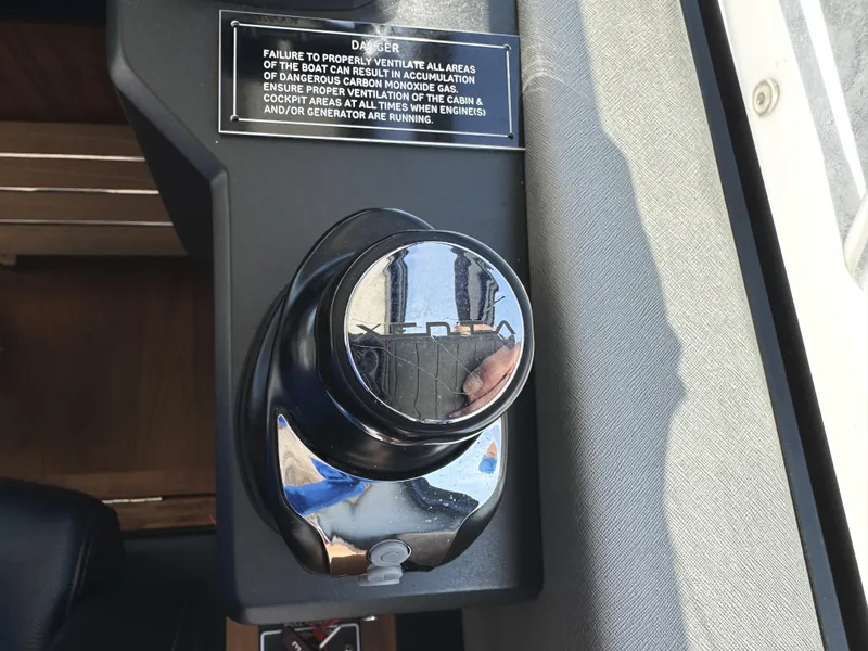 Slide: The Image of Control knob on 2019 Sunseeker Predator 57 yacht with safety warning label. - 31