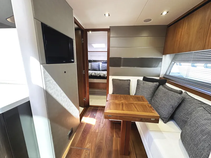 Slide: The Image of Luxurious interior of 2019 Sunseeker Predator 57 yacht with modern seating and wooden accents. - 40