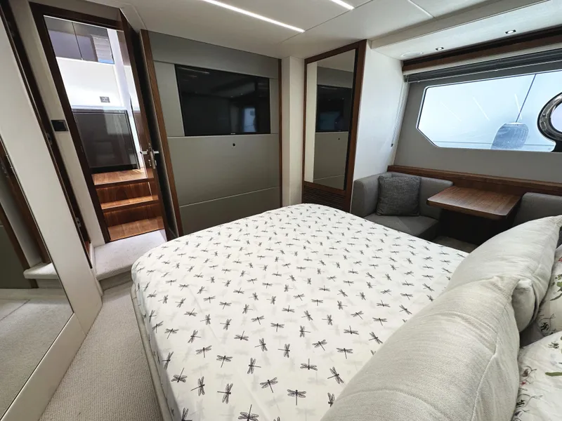 Slide: The Image of Luxurious interior of 2019 Sunseeker Predator 57 yacht with cozy bedroom and modern design. - 45