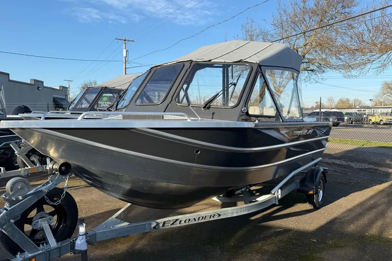 The Image of 2026 Thunder Jet 185 Luxor boat on trailer, parked outdoors, with canopy and sleek design. - 32